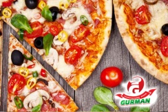 Пицца на традиционном тесте со скидкой 50% от службы доставки еды «GURMAN»